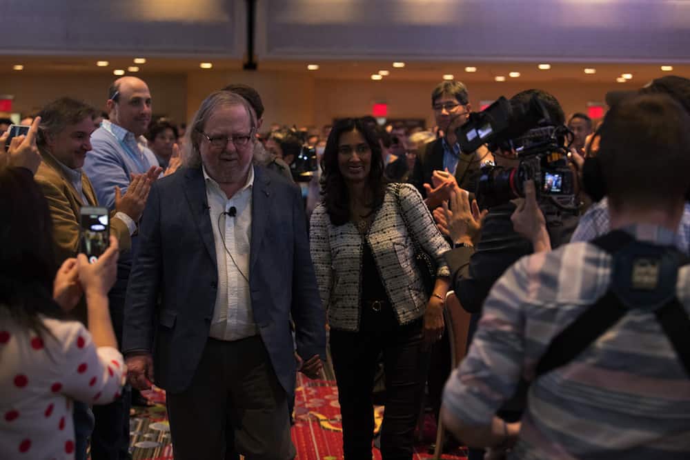 Dr. James P. Allison, 2018 Nobel Laureate, and Dr. Padmanee Sharma, his wife, make their way through a standing ovation at CICON18