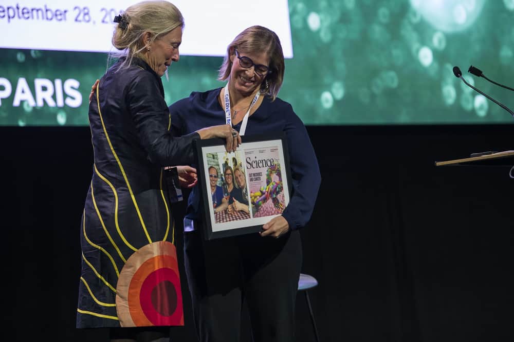 Dr. Wargo mentioned that Dr. Zitvogel served as an inspiration to her in this field and presented her with a framed picture at CICON19