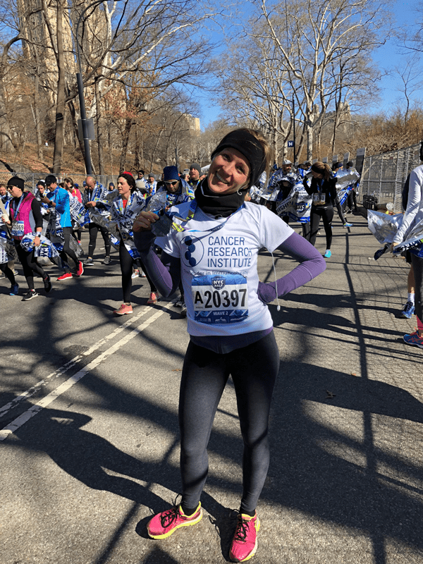 Anne Asmus with her medal at the 2018 NYC Half Marathon.