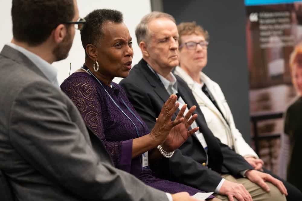 Moderator Brian Brewer (left) with panelists (left to right) Vanessa Brandon, John Ryan and Donna Lynch. Photo by Melissa Lyttle