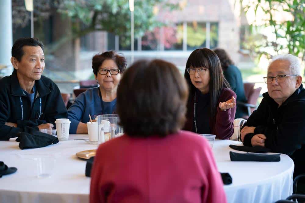 Summit attendees discussing the morning session over lunch. Photo by Melissa Lyttle.