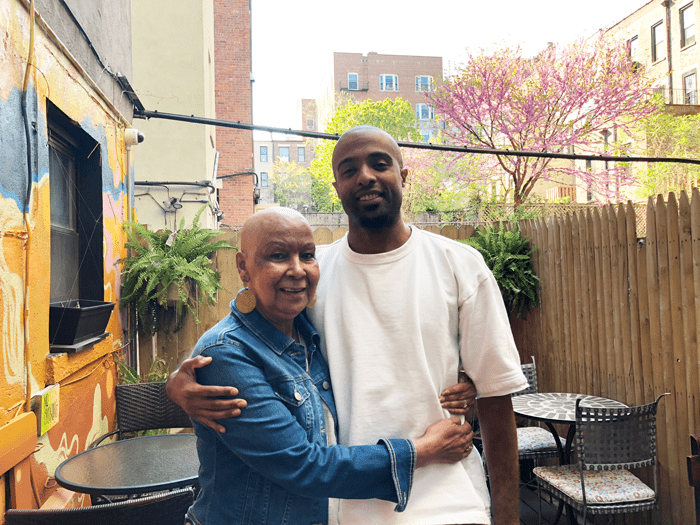 Gloria and her son Arsenio, a pharmacist, who helped advise her on immunotherapy treatment