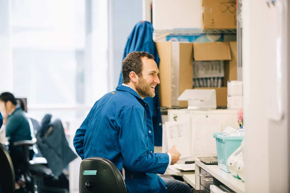 Dr. Alexander Marson sitting in his laboratory at UCSF. Photo by Anastasiia Sapon.