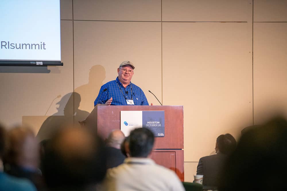 Dale Biggs sharing his experience with immunotherapy. Photo by Ranjani Groth