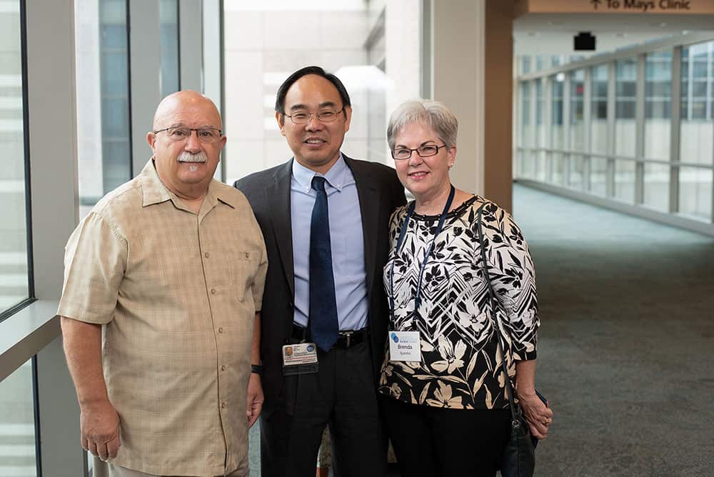 Ron Speidel (left) with his oncologist Dr. Jian Jun Gao and his wife, Brenda Speidel. Photo by Ranjani Groth