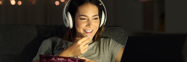 woman watching movie on laptop