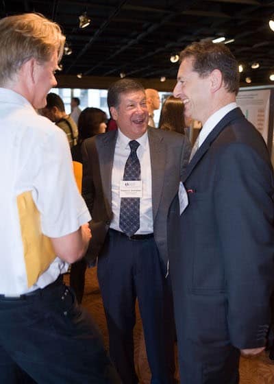 Dr. Schreiber, conversing with colleagues Mark J. Smyth, PhD, and Jonathan Cebon, PhD, at a CRI Symposium in 2007.