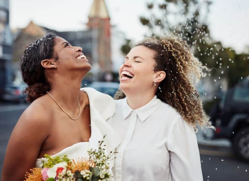 Two happy people smile during their wedding celebration