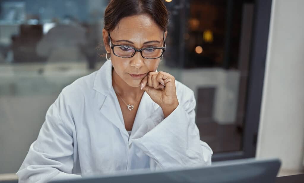 Scientist studies a computer screen