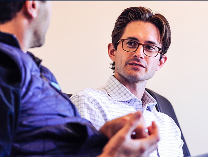 Two people engaged in conversation