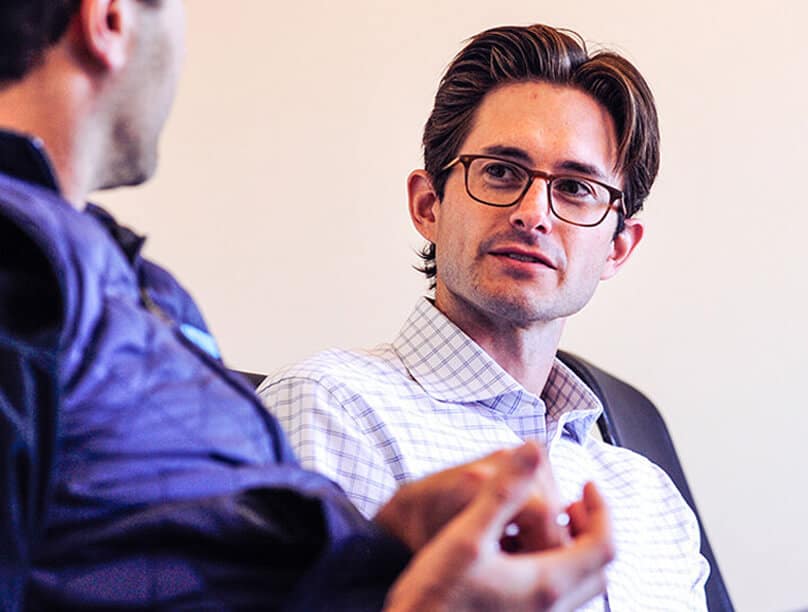 Two people engaged in conversation