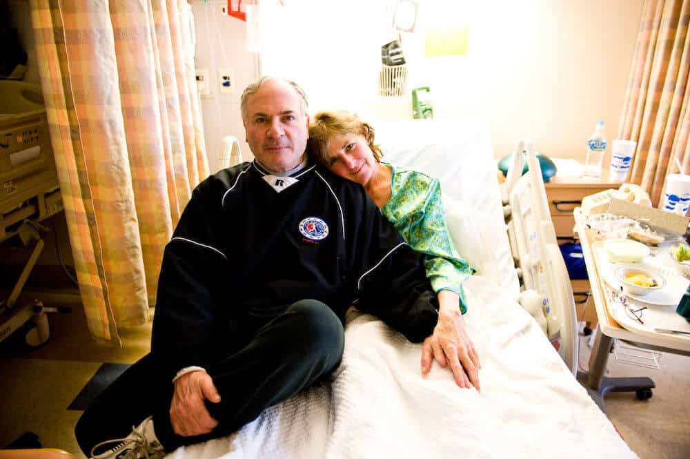 patient in hospital bed with partner