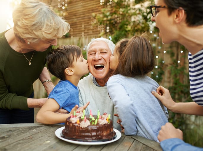 Grandkids kissing their Grandfather for his birthday,