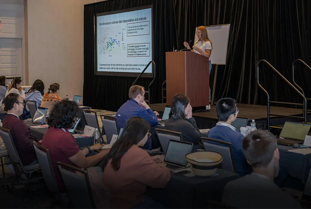 Katie Campbell presents on stage