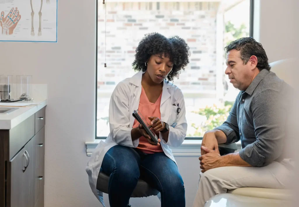 A doctor consults with a patient